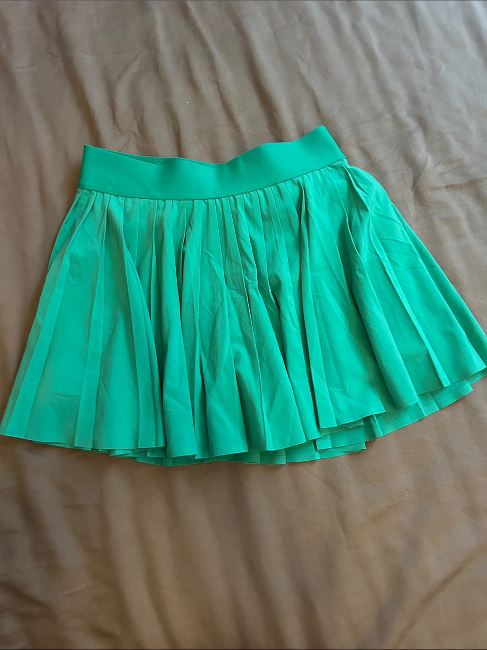 Aritzia Emerald Green Pleated Tennis Skirt with shorts beneath
